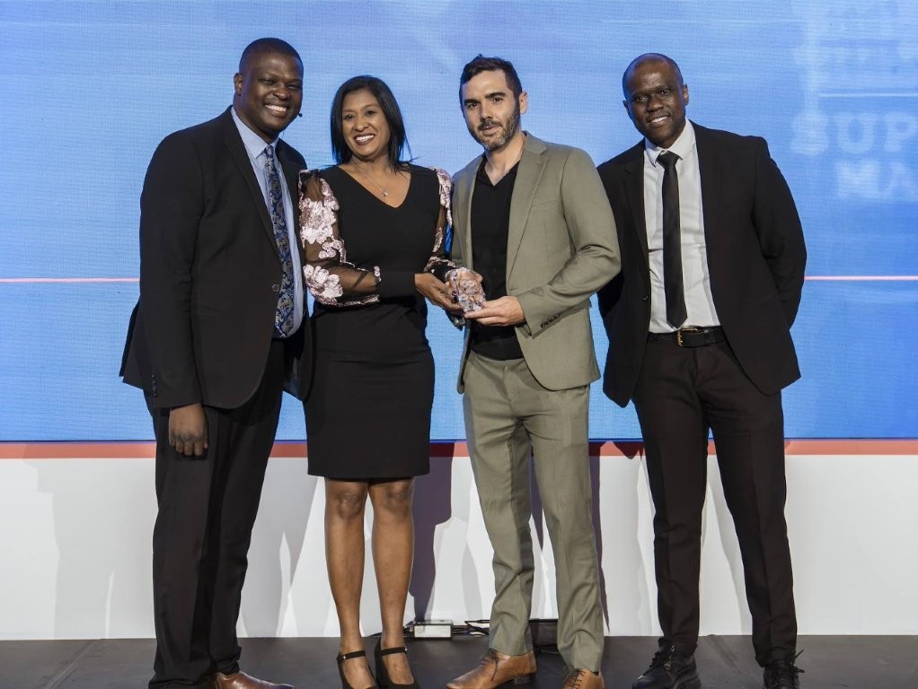 Best Speaker Award Winner Renier Louw with SAPICS directors Jonathan Mphake, Regina Naicker (left) and SAPICS president Thato Moloi (right)